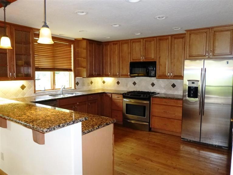 Huge kitchen with new cabinetry, hardwoo