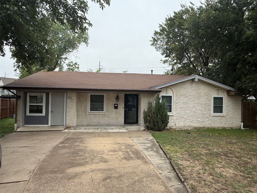 Ranch-style home featuring roof with shingles and covered porch
