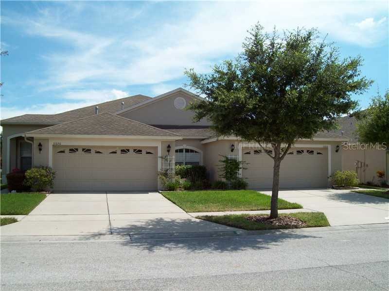 Exterior Front - Villa for sale is on the right.