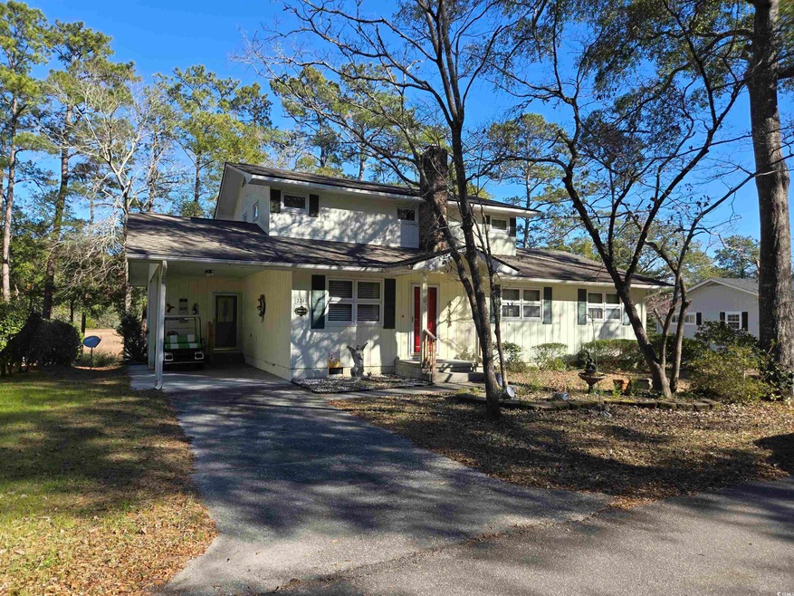 View of front of house featuring an attached carpo