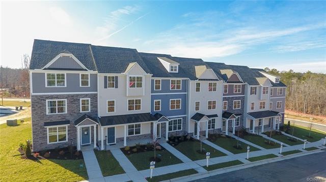 Photo of another row of homes. Actual features and