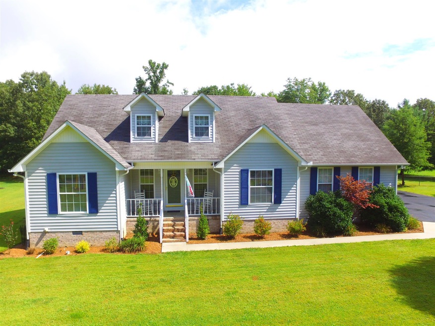 110 Sharon Drive. .88 Acres with 3 bedrooms, 2 baths, bonus, granite in kitchen and master bath and a large pool!