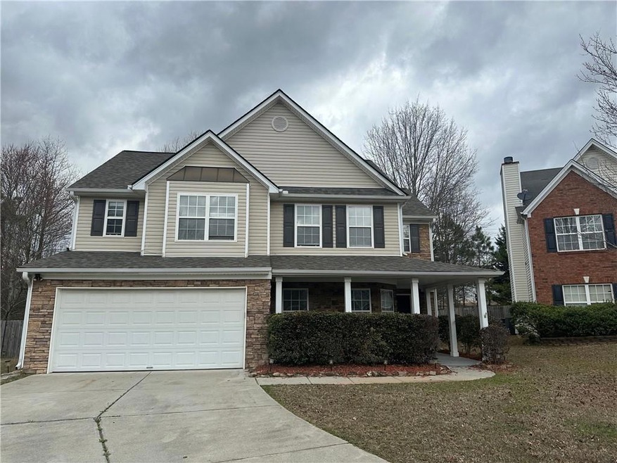 View of front of property with a garage