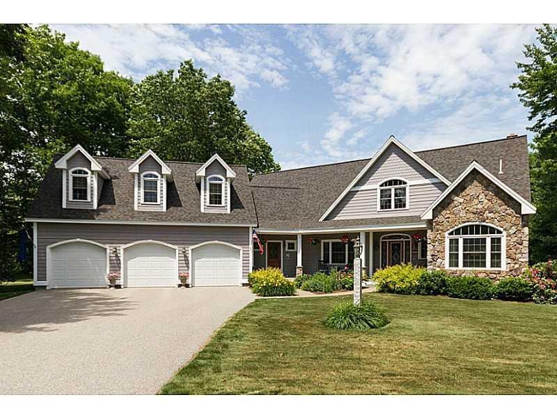 Exterior Front. Perennial gardens...