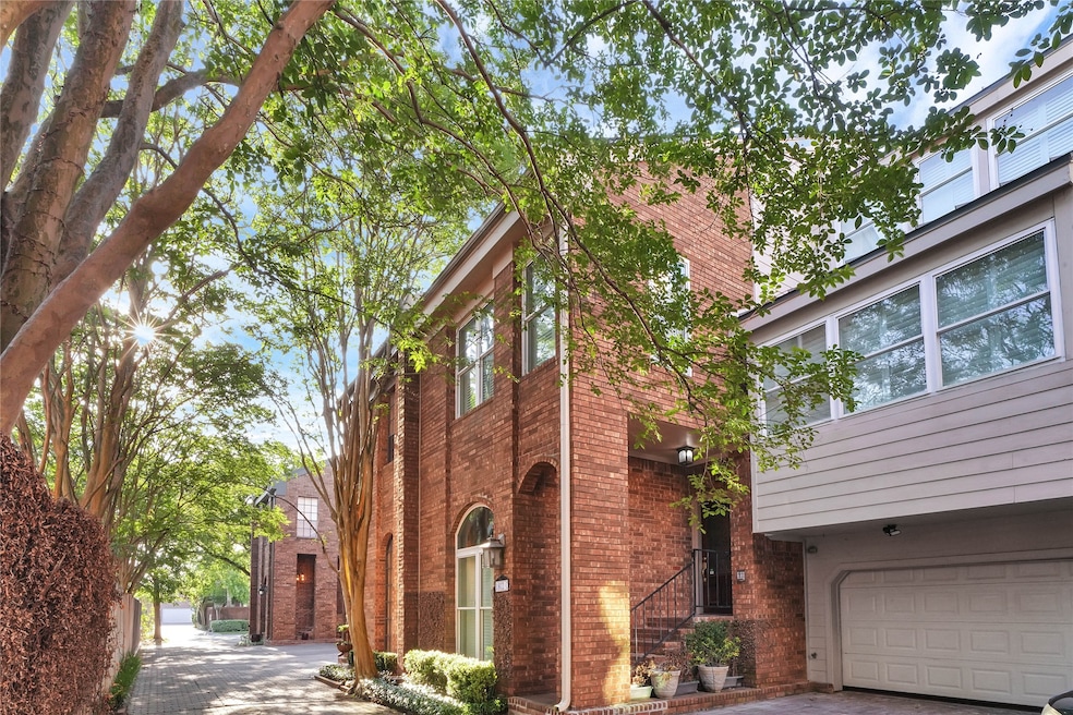 This photo showcases a charming brick townhouse wi