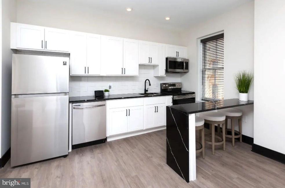 938 N Calvert St unit 1B, Baltimore, MD 21202 - photo 1