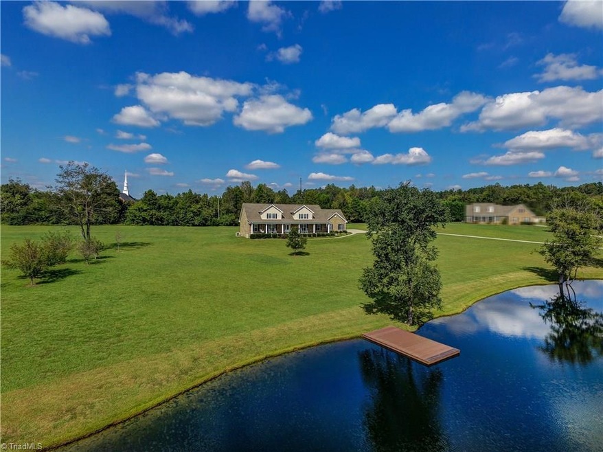 This home is well situated on over 5 acres to take advantage of lake views from nearly every room. Covered front porch, spacious entry, generously sized rooms, freshly painted, neutral decor and louvered blinds throughout make this a move-in ready option!