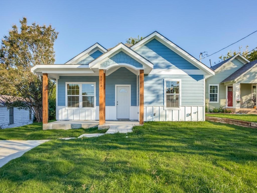 Bungalow-style home with a front lawn and covered 