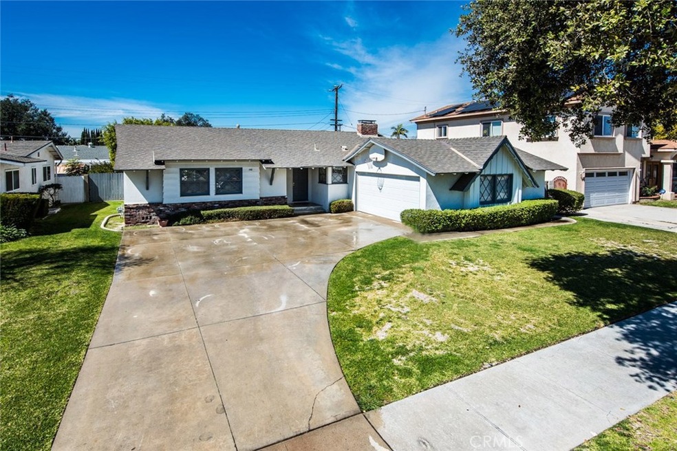The view from the street of this wonderful home.  Notice the oversized driveway with plenty of space to park, plus the attached 2 car garage.