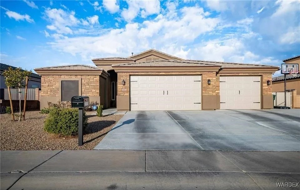 Single story home featuring a garage