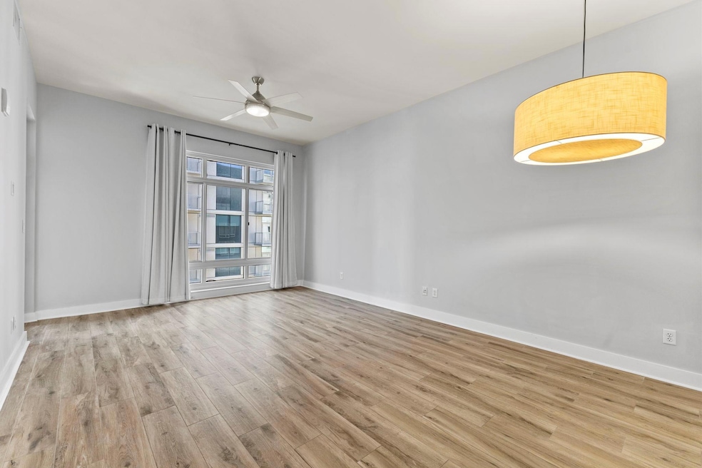 Spare room featuring wood finished floors, a ceil