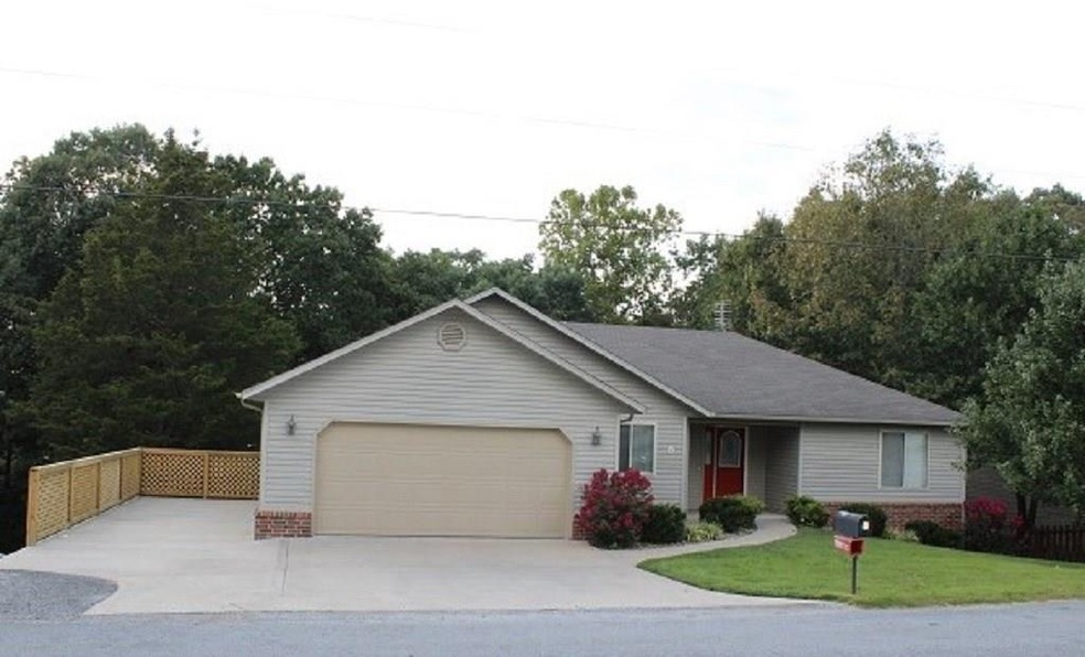 Level driveway and extra parking area.