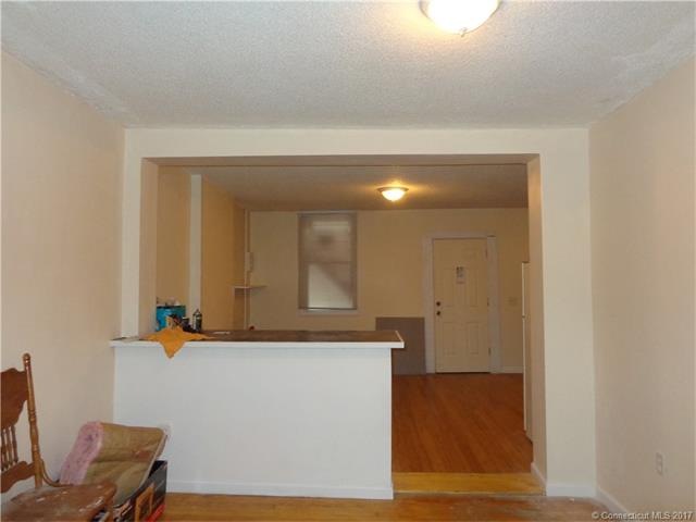 Living room with pass thru to renovated eat-in kit