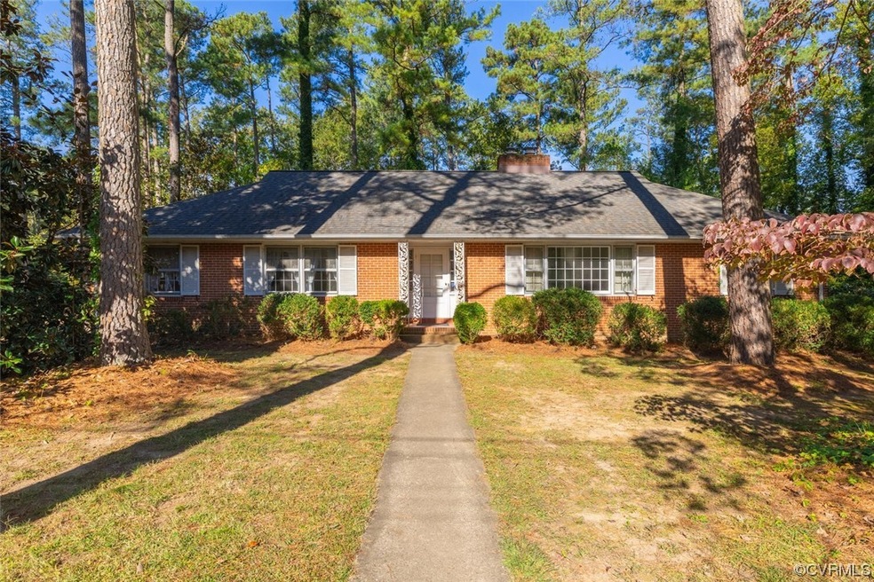 Ranch-style house featuring a front yard