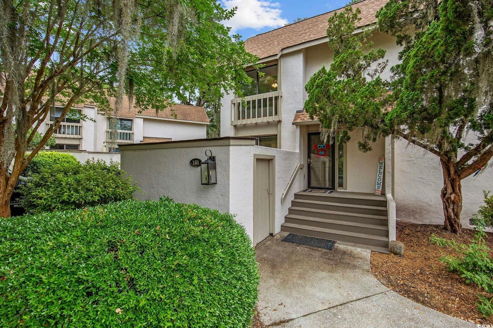 Entrance to property with stucco siding