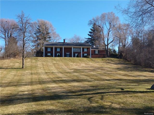 Back yard with sloping hill