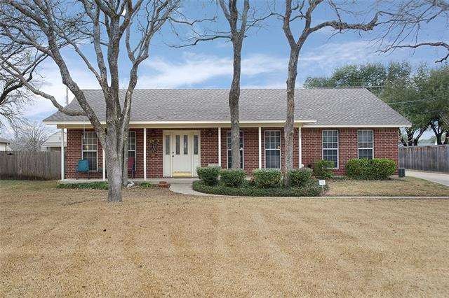 Front view, large yard.