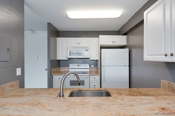 The kitchen features granite counters.
