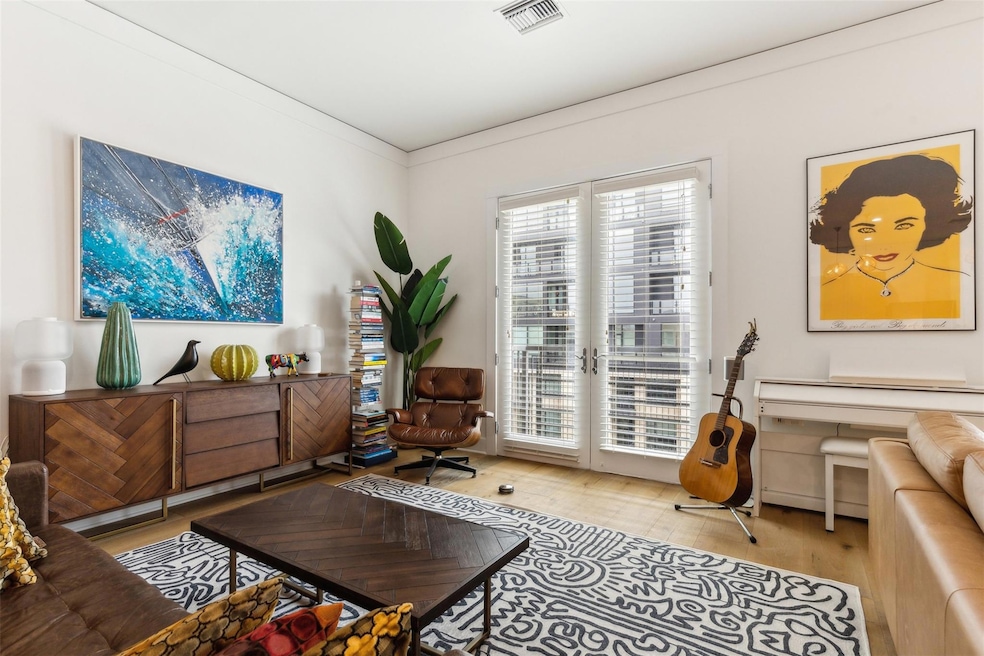 Sitting room featuring visible vents, french doors