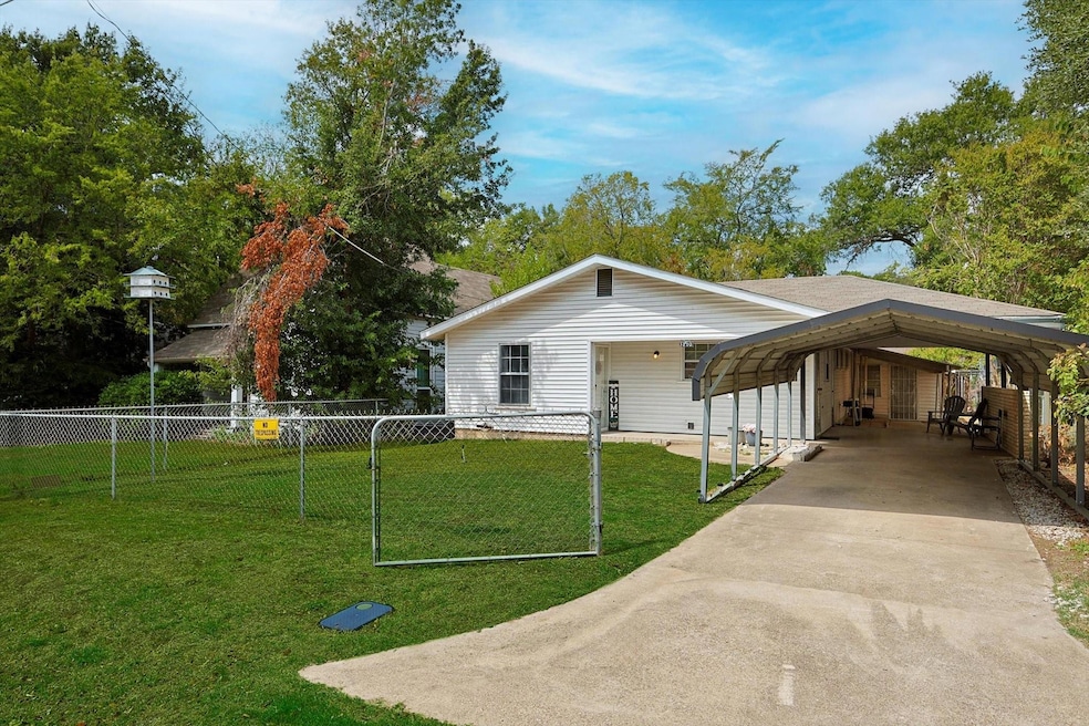 Fully gated property with 2-car carport.
