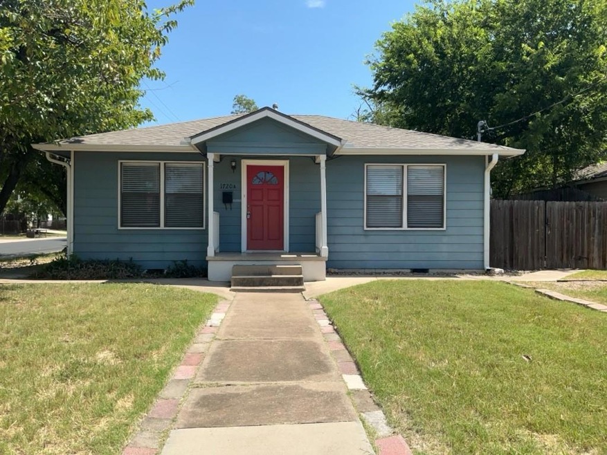 Bungalow-style home with a shingled roof