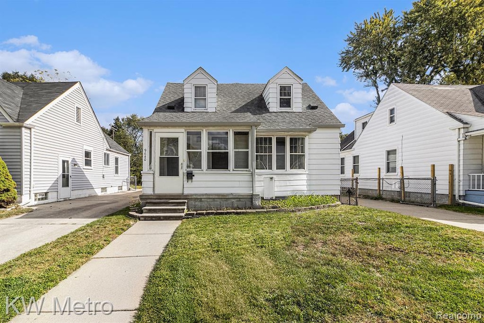 Cape cod home with roof with shingles and a sunroom