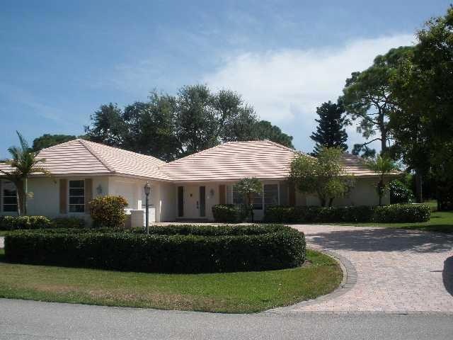 Exterior Front. LARGE PAVER DRIVEWAY