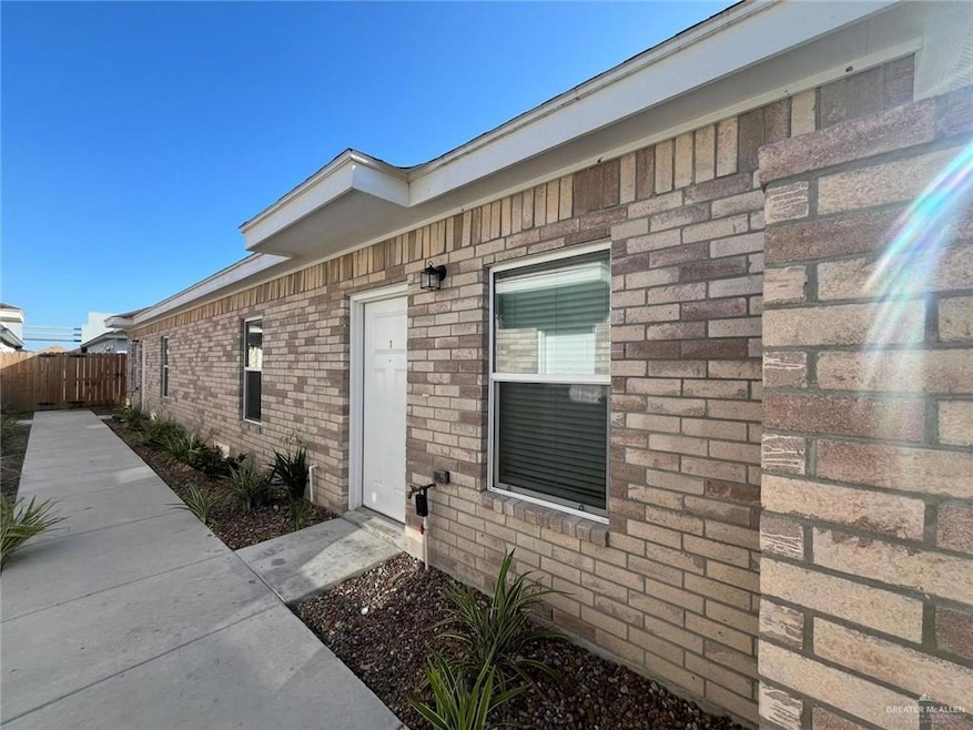 Property entrance with brick siding