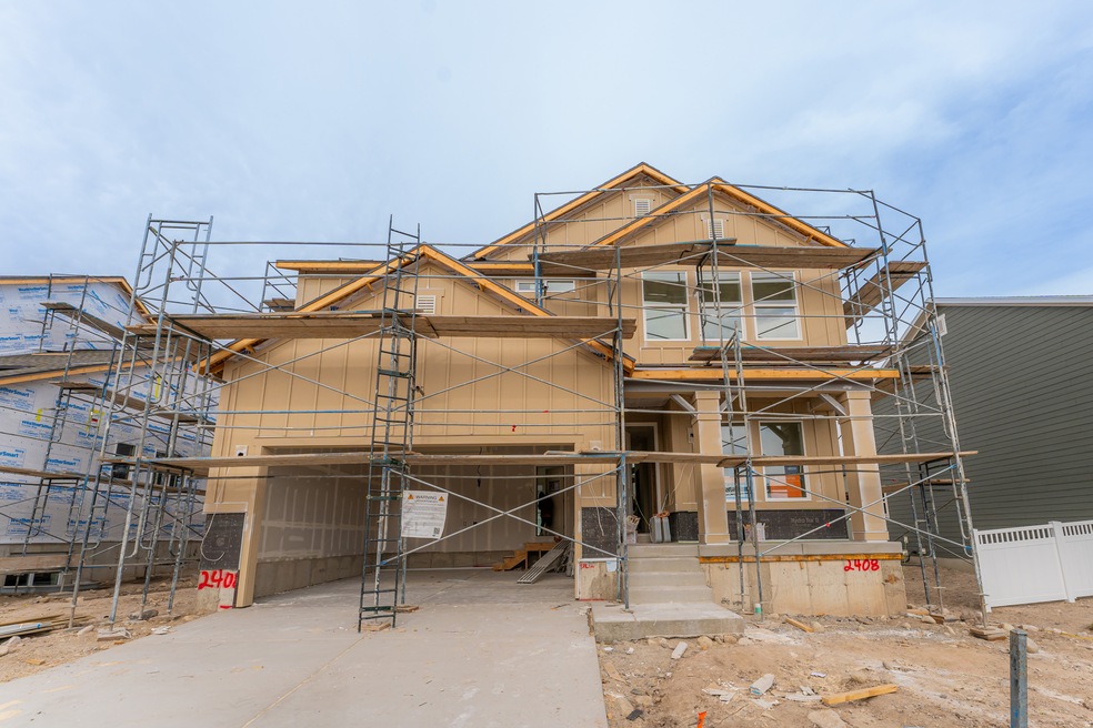 Property under construction with concrete driveway