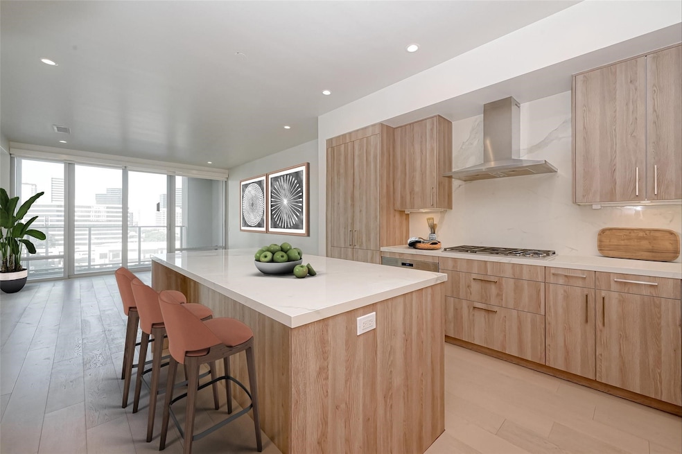 Welcome Home to Unit 806 at The Wilshire. Kitchen Island view- virtual staged
