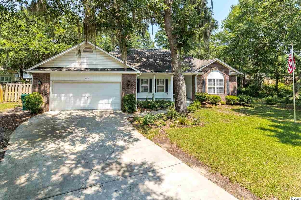Nestled by the trees, you find this Lovely sprawli
