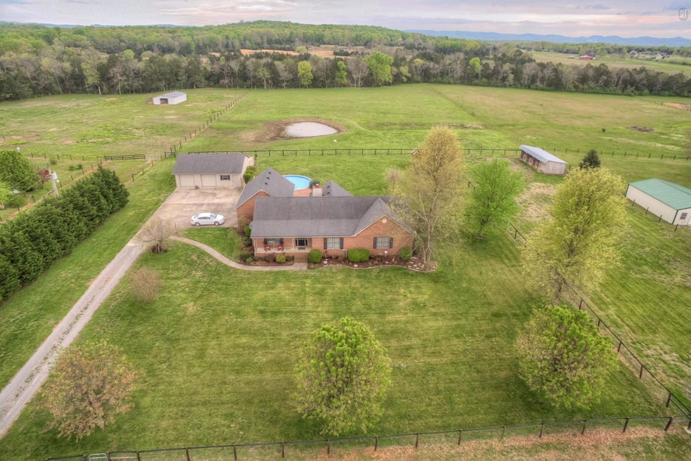 Country living at its best! This picturesque home is on 7.39 acres and offers an abundance of features!
