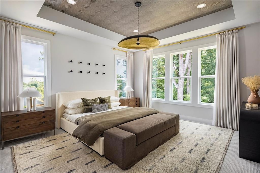 Bedroom featuring a tray ceiling
