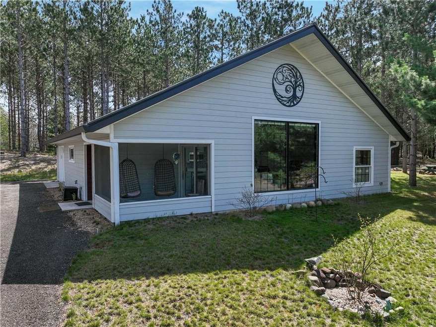 Zero entry home, these views overlook North Sand Lake. Screened porch to the left.