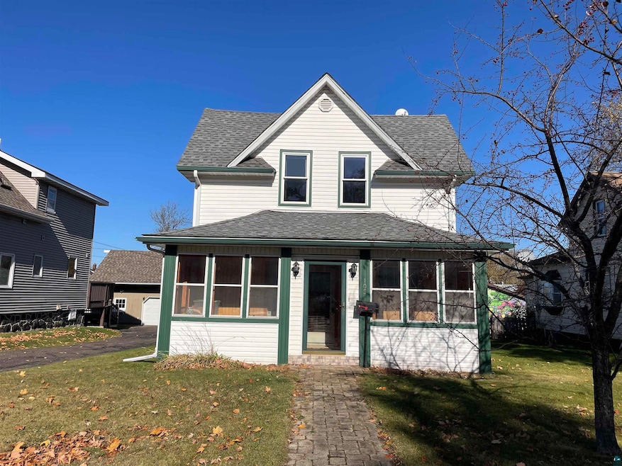 View of front of home featuring a sunroom and a fr