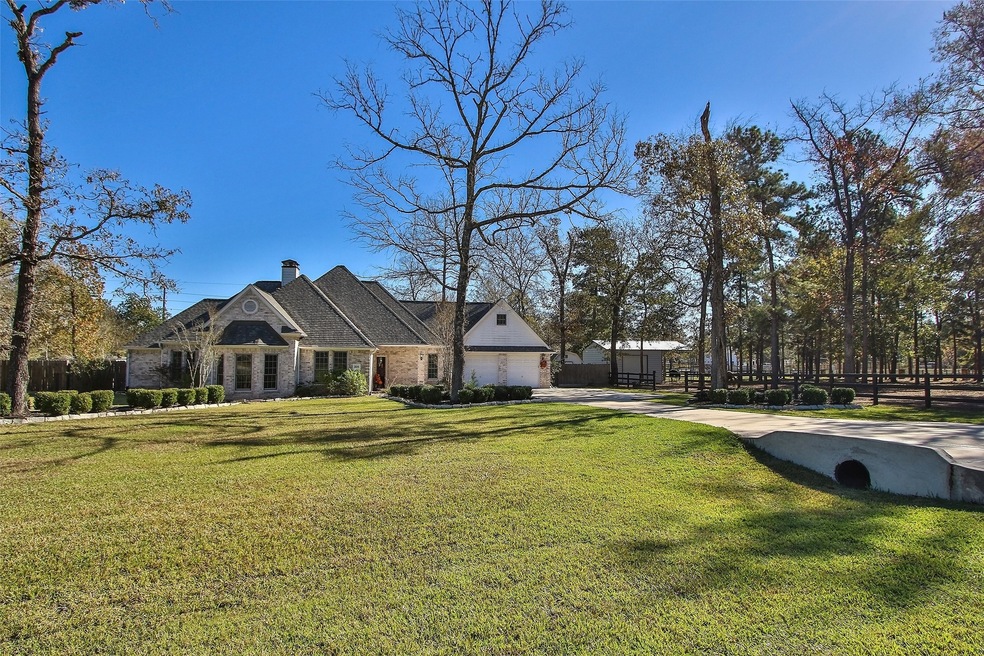 Gorgeous brick home on 1.99 acs (+/-), gated ranch community! Come 7 miles south of Magnolia, and features two private parks and nearby hiking and horseback riding trails.