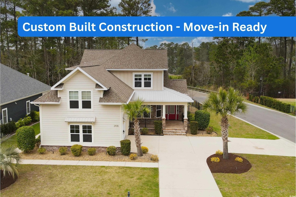 View of front of house with a front yard, concrete