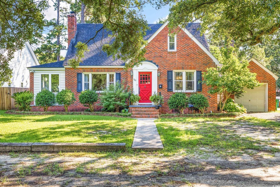 View of front of house featuring a garage and a fr