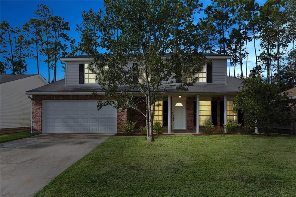 Come home to this spacious beauty in Slidell! Less