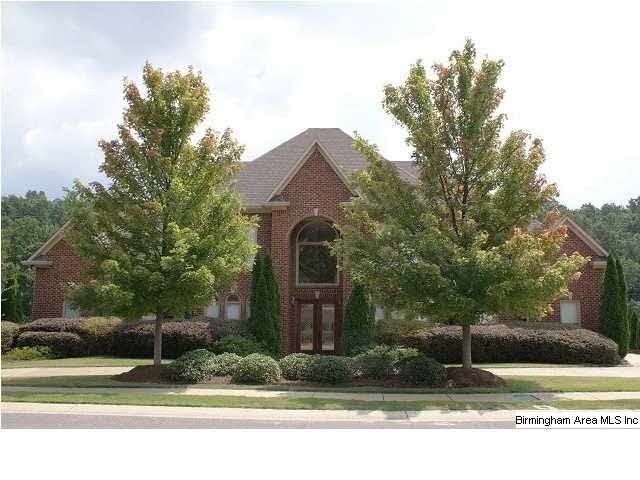 A stately full brick home on a huge lake lot. Simp