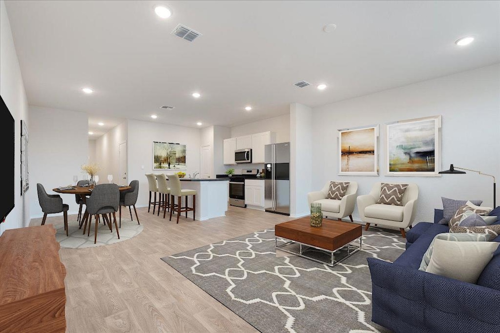 Living area with light wood-style flooring and re