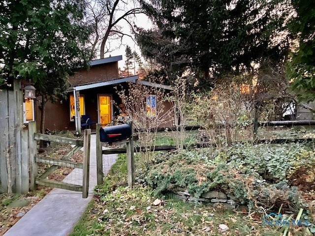 Front of Home with extra Lot