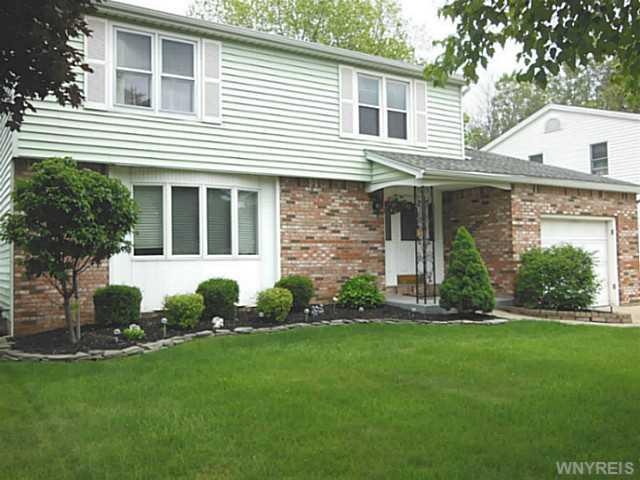 Exterior Front. Beautiful landscaping.