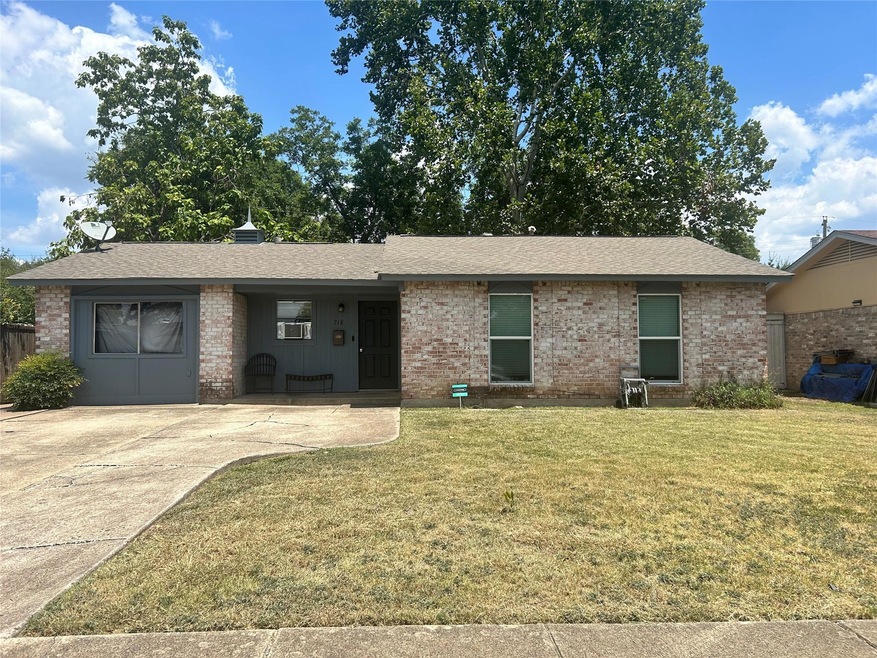 Ranch-style home featuring a front lawn
