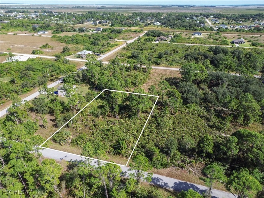 Aerial view of property's location featuring property parcel outlined