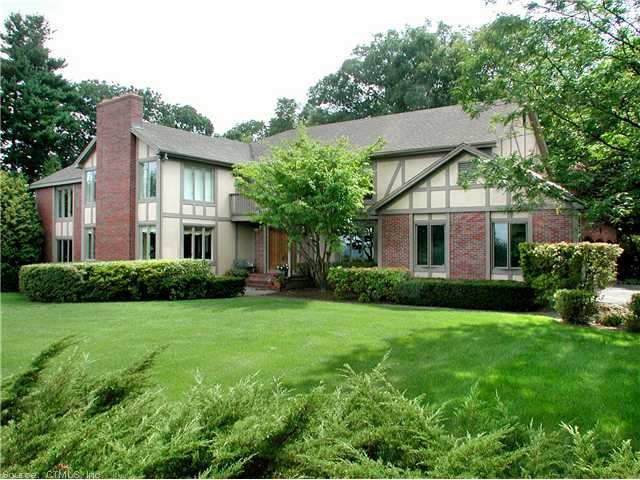 Exterior Front. Lush landscaping surrounds this sp