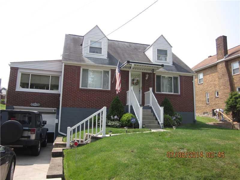 Exterior Front. Newer roof, windows, railings, con