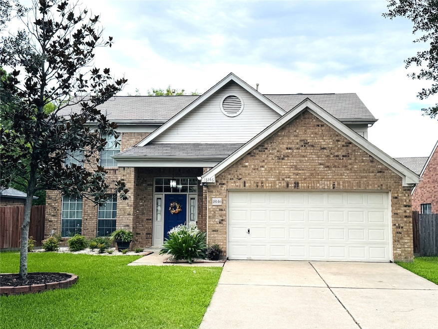 FRONT OF HOME WITH EXTENDED DRIVEWAY