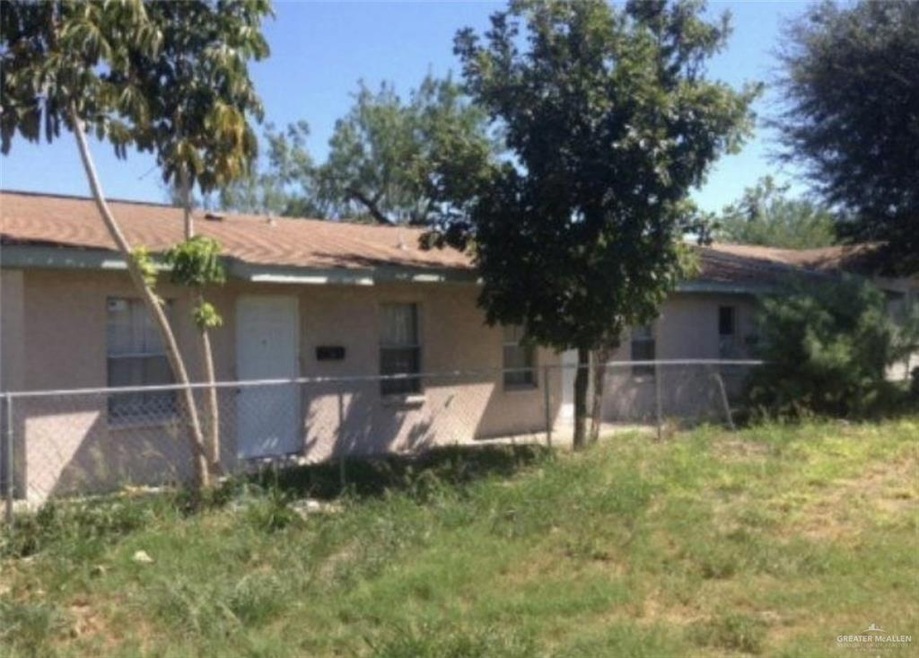 Rear view of house featuring stucco siding