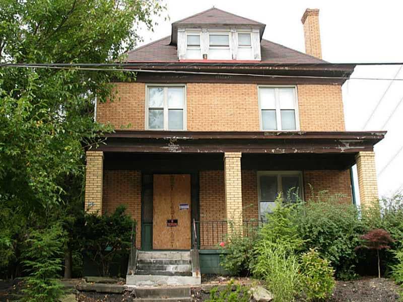 Exterior Front. Study Brick 3 story on corner lot 